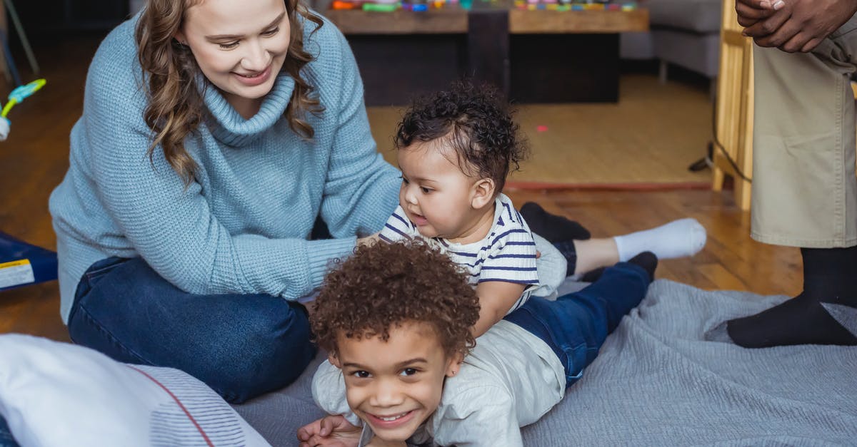 Macarons are wrinkled, cracked and have no feet - Ethnic family playing with kids at home Macarons are wrinkled, cracked and have no feet - Ethnic family playing with kids at home