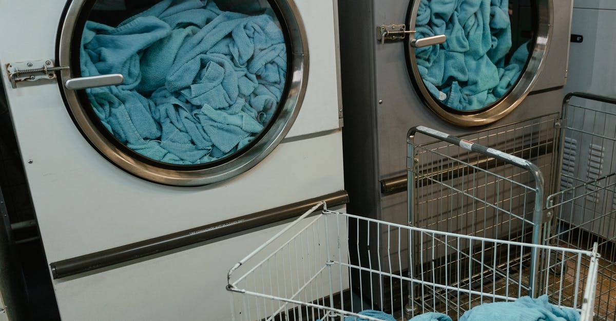 Machine washed my cake pans - White and Gray Washing Machine with Blue Fabrics inside Machine washed my cake pans - White and Gray Washing Machine with Blue Fabrics inside