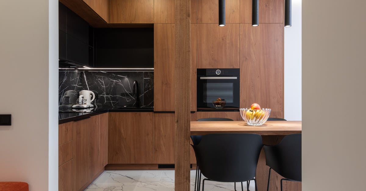 Make fruit last longer in fridge? - Wooden furniture and table in contemporary kitchen with dining zone Make fruit last longer in fridge? - Wooden furniture and table in contemporary kitchen with dining zone