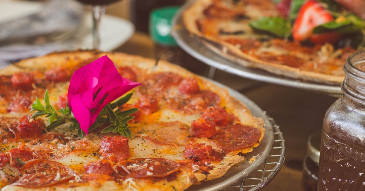 Make Pepperoni out of Regular Salami - Tray of Pizza Selective-focus Photography Make Pepperoni out of Regular Salami - Tray of Pizza Selective-focus Photography