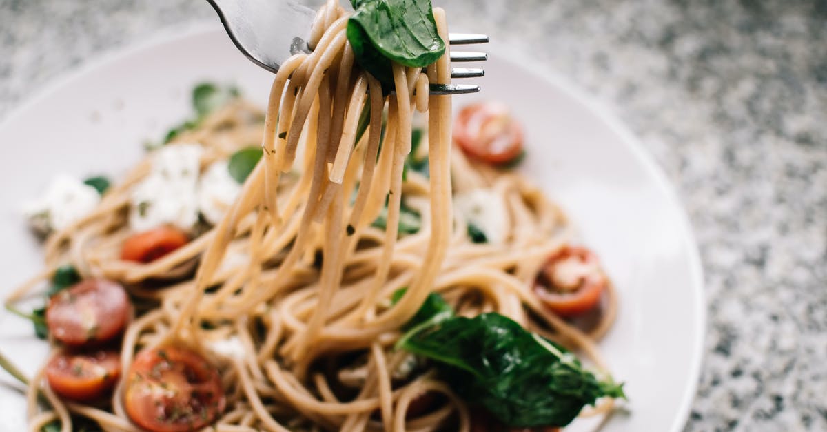 Making a sauce with mascarpone cheese - Selective Focus Photography of Pasta With Tomato and Basil Making a sauce with mascarpone cheese - Selective Focus Photography of Pasta With Tomato and Basil
