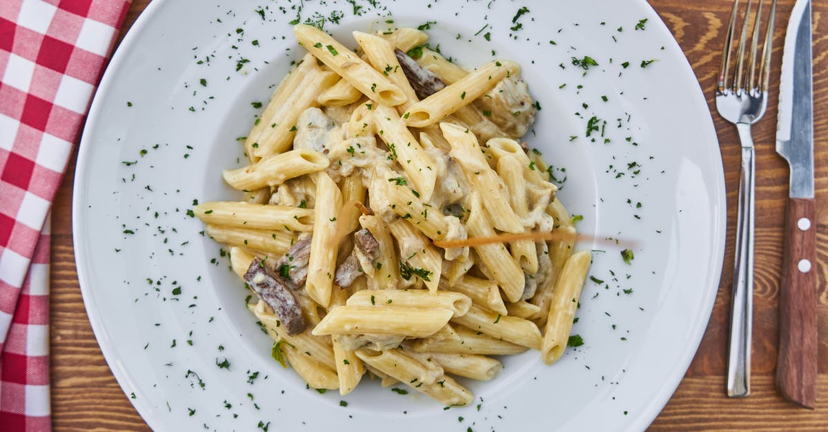 Making a sauce with mascarpone cheese - Flat Lay Photography of Pasta Served in White Plate Making a sauce with mascarpone cheese - Flat Lay Photography of Pasta Served in White Plate