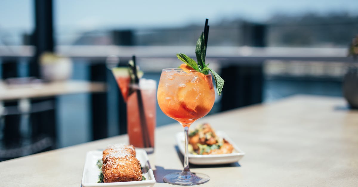 Making culinary foams for cocktails - Delicious cocktails with meals on table