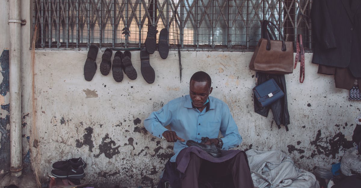 Making large quantities of tea with bags - Man in Blue Shirt Sitting on the Street Repairing Shoe Making large quantities of tea with bags - Man in Blue Shirt Sitting on the Street Repairing Shoe