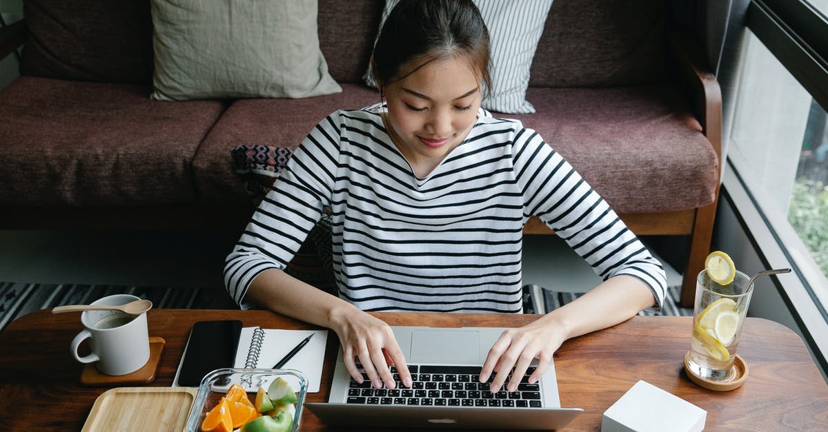 Making Subway-like salads at home w/ zero work - Asian freelancer typing on laptop at table with lemonade indoors