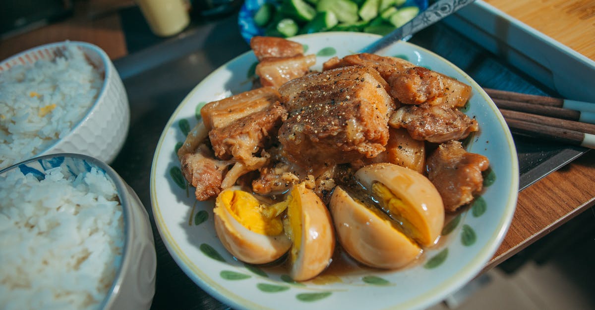 Marinade then cook or cook then marinade? - A Delicious Pork Adobo with Hard Boiled Eggs in a Bowl Beside Rice Marinade then cook or cook then marinade? - A Delicious Pork Adobo with Hard Boiled Eggs in a Bowl Beside Rice