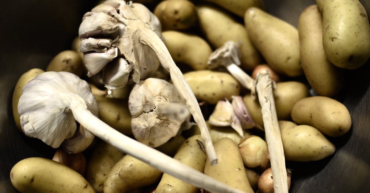 mashed potatoes - fixing undercooked potatoes - Close-Up Shot of Potatoes and Garlic mashed potatoes - fixing undercooked potatoes - Close-Up Shot of Potatoes and Garlic
