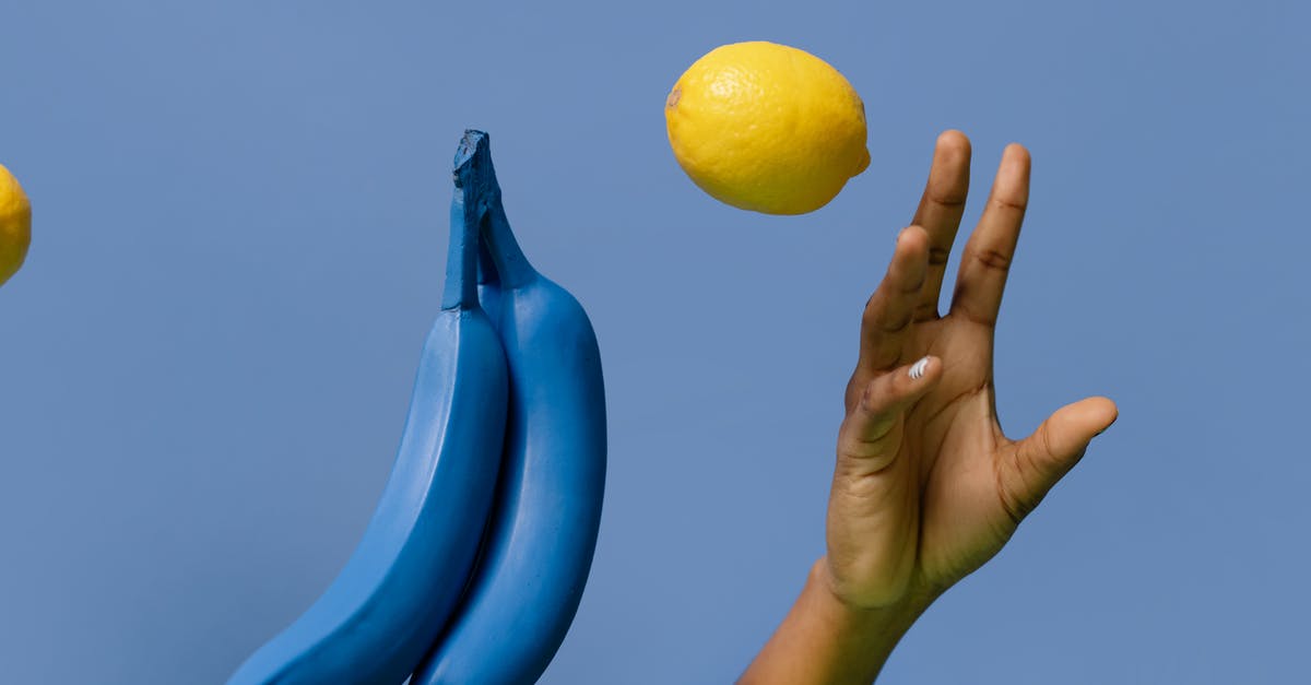 Mashing bananas for Muffins: By hand or with blender? - Close-Up Shot of a Person Holding a Lemon and Bananas Mashing bananas for Muffins: By hand or with blender? - Close-Up Shot of a Person Holding a Lemon and Bananas