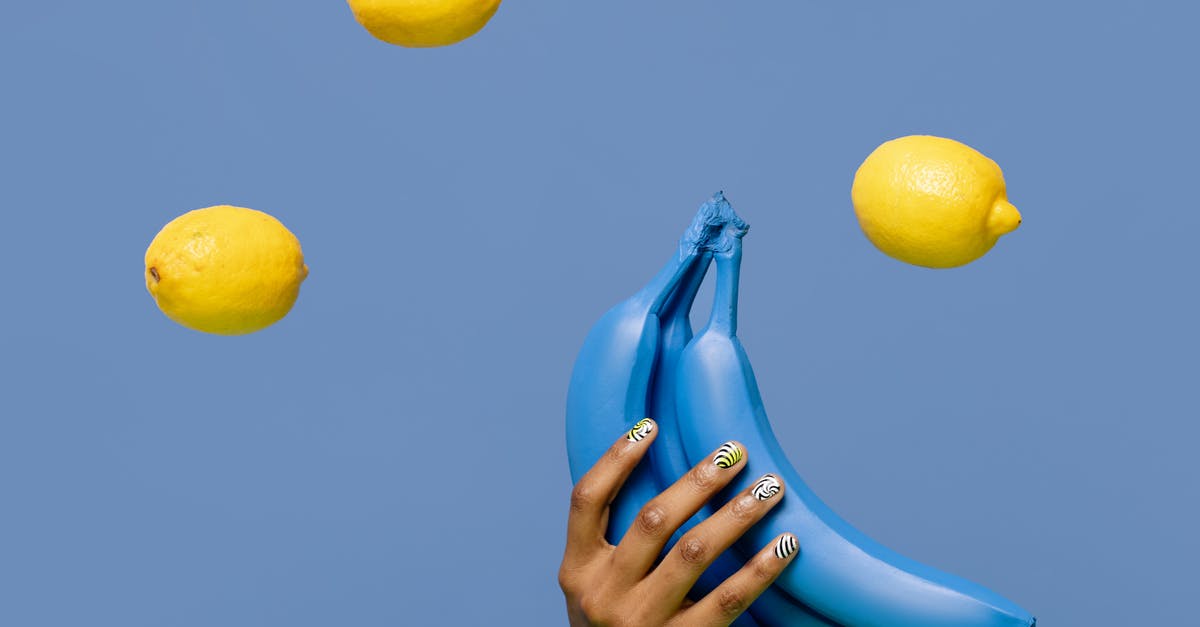 Mashing bananas for Muffins: By hand or with blender? - Close-Up Shot of a Person Holding Blue Bananas Mashing bananas for Muffins: By hand or with blender? - Close-Up Shot of a Person Holding Blue Bananas