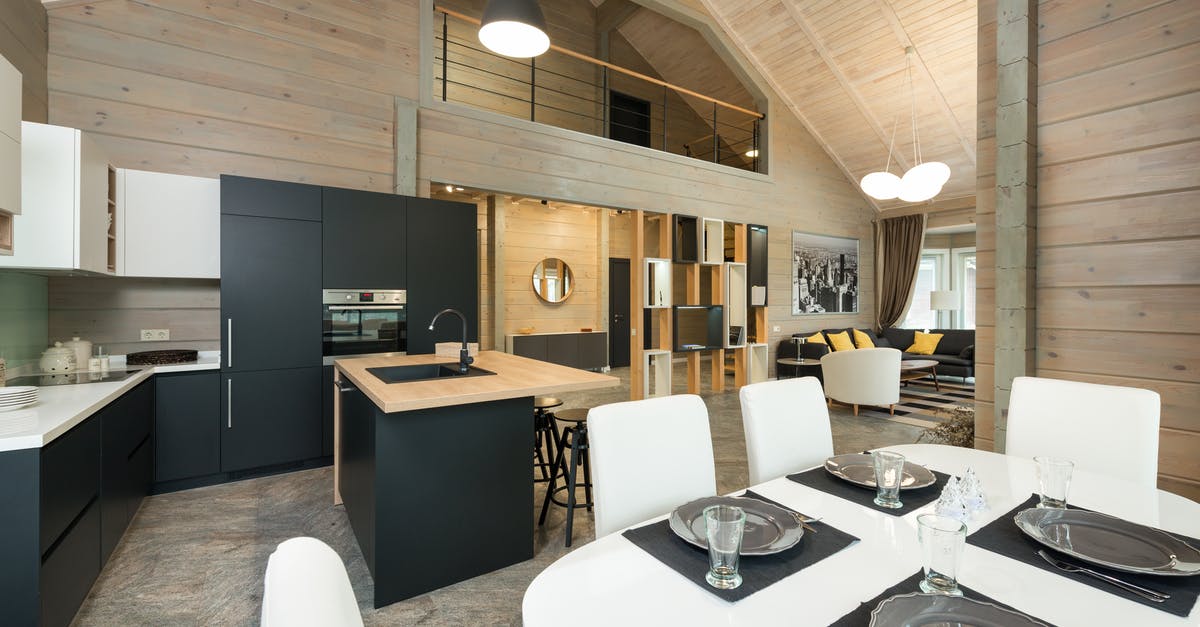 Maximum oven temperature for glass cookware - Plates with cutlery and glassware on dining table in stylish kitchen with built in appliances in mansion Maximum oven temperature for glass cookware - Plates with cutlery and glassware on dining table in stylish kitchen with built in appliances in mansion
