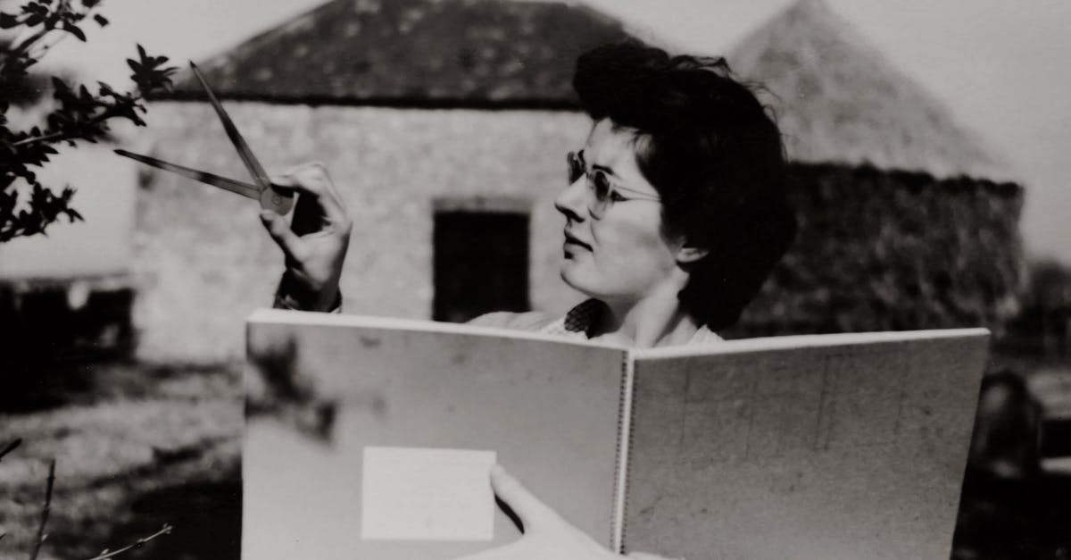 Measuring egg whites - Woman in White Long Sleeve Shirt Holding a Book While Measuring A Leaf Measuring egg whites - Woman in White Long Sleeve Shirt Holding a Book While Measuring A Leaf