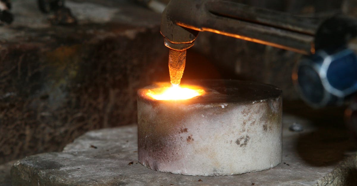 Melting sugar on creme brulee with blow torch - Selective Focus Photography of Welding Torch on Concrete Round Bar Melting sugar on creme brulee with blow torch - Selective Focus Photography of Welding Torch on Concrete Round Bar
