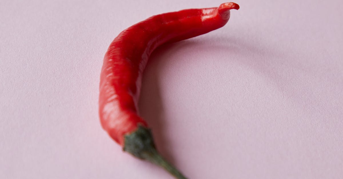 Method for including bacon in an otherwise vegan chili? - Fresh ripe red chili pepper placed on white surface Method for including bacon in an otherwise vegan chili? - Fresh ripe red chili pepper placed on white surface