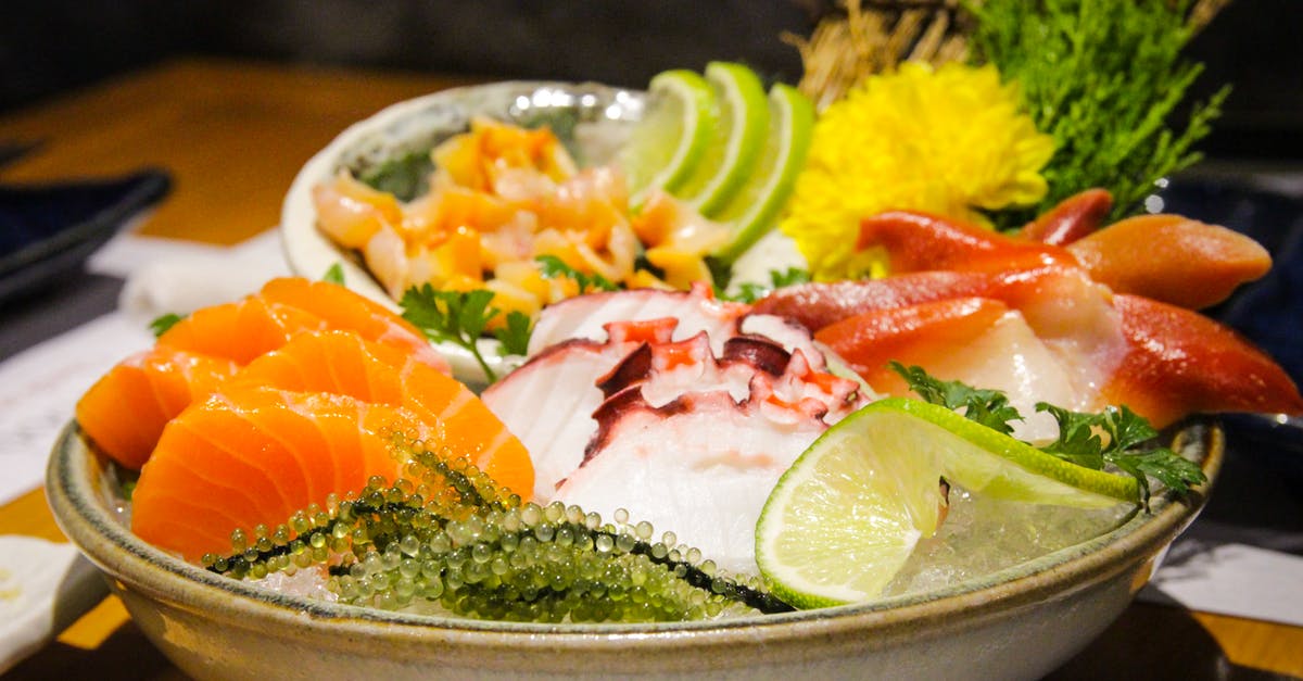 Mexican ceviche vs. Japanese sashimi - Served cold sashimi with herbs and condiments Mexican ceviche vs. Japanese sashimi - Served cold sashimi with herbs and condiments