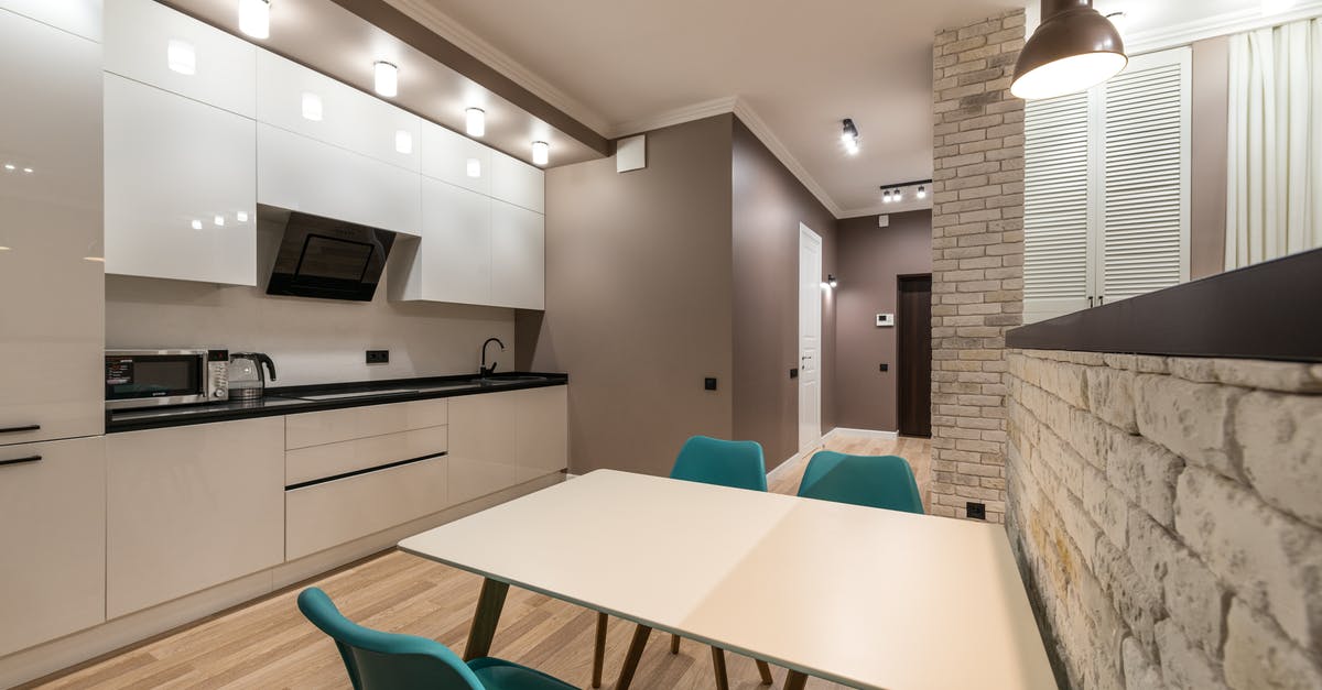 Microwave oven equipment - Stylish kitchen with table and kitchenware Microwave oven equipment - Stylish kitchen with table and kitchenware