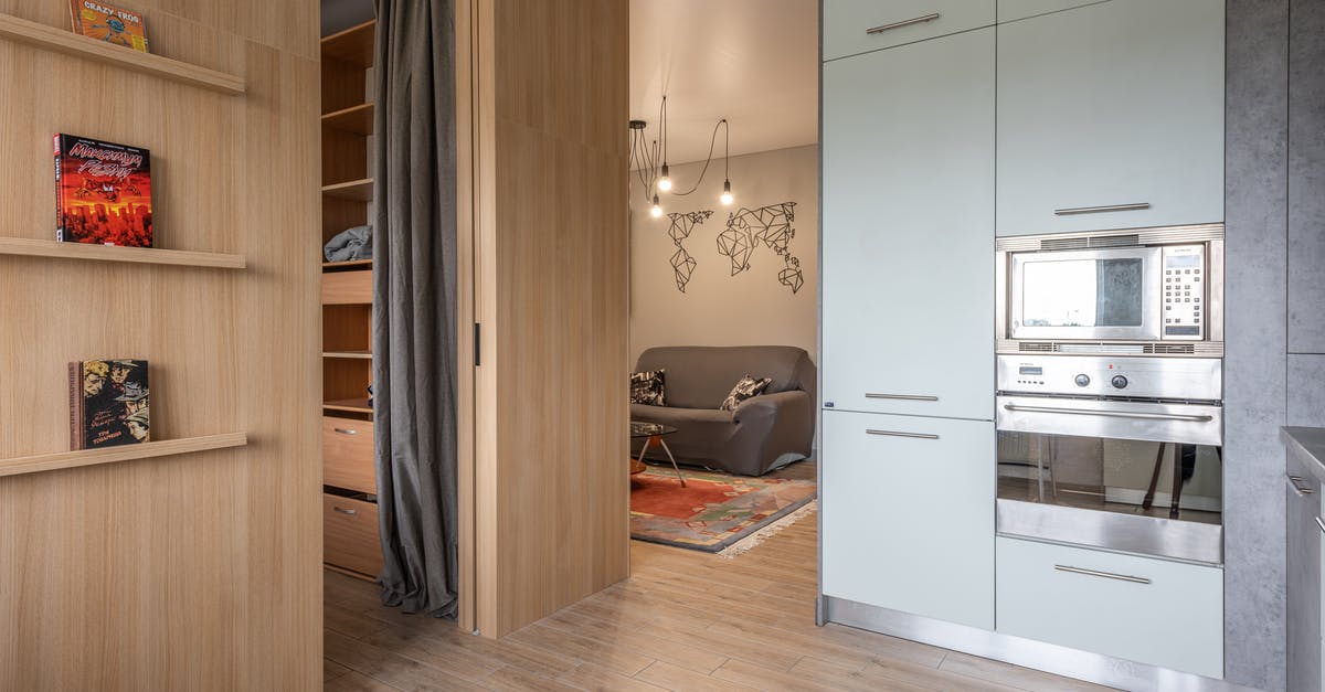 Microwave oven grill heating element not glowing - House with cupboards in kitchen near bookshelves and living room Microwave oven grill heating element not glowing - House with cupboards in kitchen near bookshelves and living room