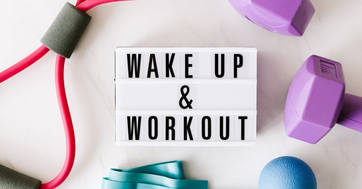 Microwave Power settings - Wake up and workout title on light box surface surrounded by colorful sport equipment Microwave Power settings - Wake up and workout title on light box surface surrounded by colorful sport equipment