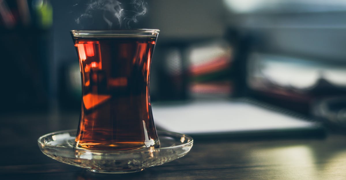 Microwave steaming - venting/holes optional? - Close-up Photo of Steaming Black Tea in Glass Microwave steaming - venting/holes optional? - Close-up Photo of Steaming Black Tea in Glass
