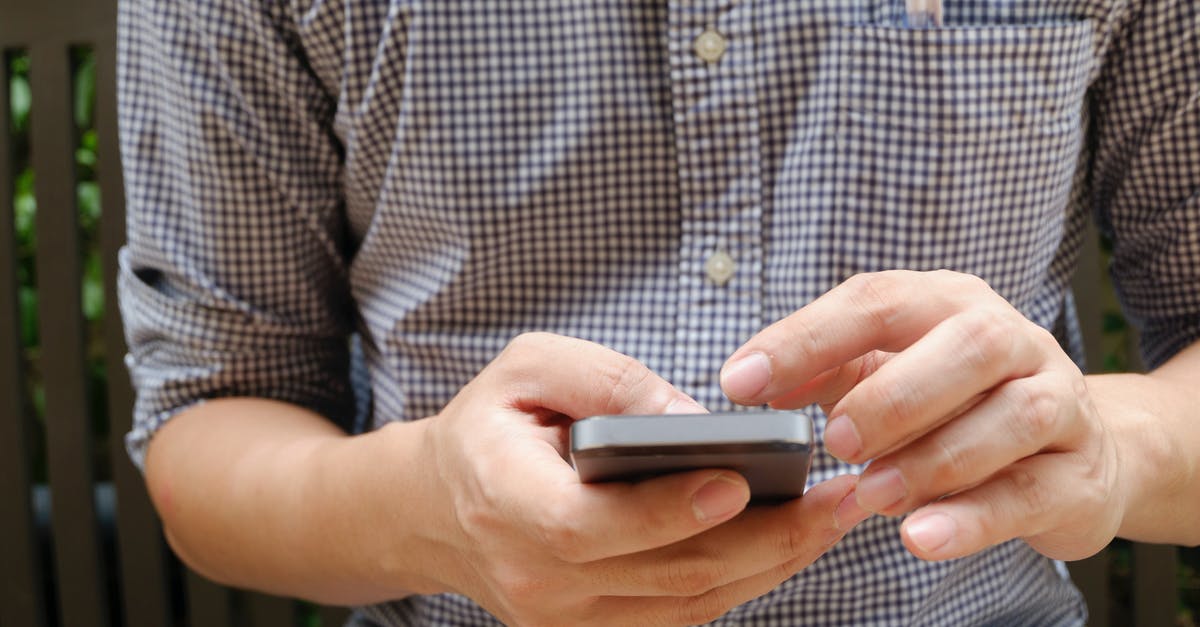 microwave use after cell phone heating - Man in Plaid Shirt Using Smartphone microwave use after cell phone heating - Man in Plaid Shirt Using Smartphone