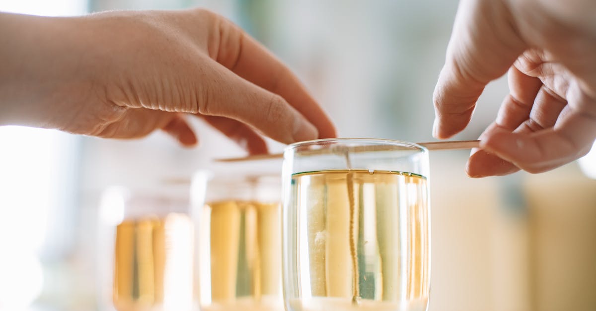 Milk for Coffee - Shake and Hit - Person Holding Clear Glass Jar With Yellow Liquid Milk for Coffee - Shake and Hit - Person Holding Clear Glass Jar With Yellow Liquid
