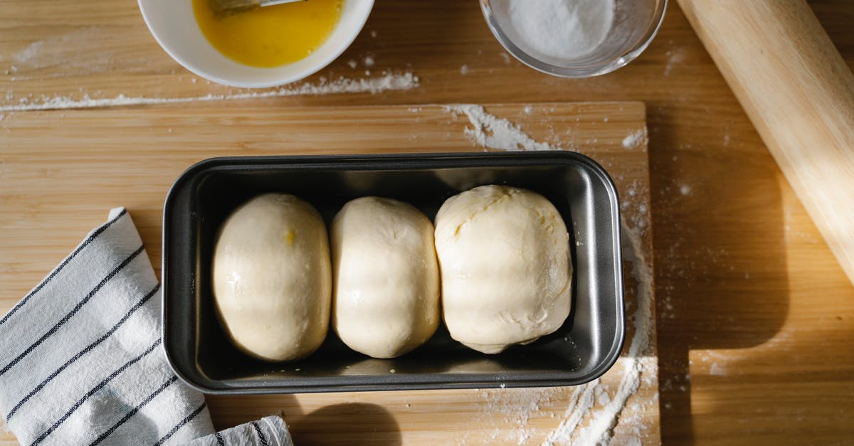 Milk in fermented bread dough - White Bread on Stainless Steel Tray Milk in fermented bread dough - White Bread on Stainless Steel Tray