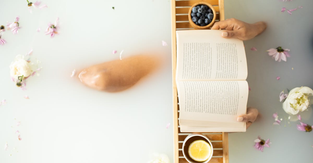 Milk temperature for white sauce - Top view of crop unrecognizable lady in white water in bathtub with fresh colorful flower petals with wooden tray with cup of tea with lemon and blueberries while reading book Milk temperature for white sauce - Top view of crop unrecognizable lady in white water in bathtub with fresh colorful flower petals with wooden tray with cup of tea with lemon and blueberries while reading book