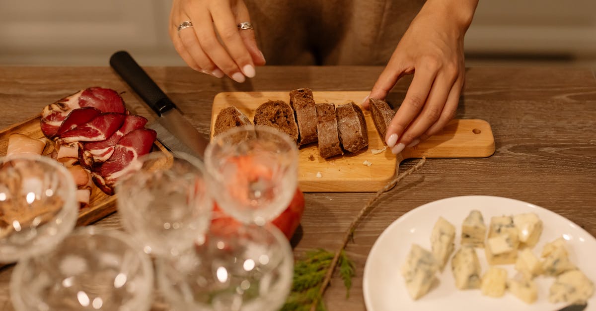 Minimum preparation for baking a whole fish - Person Holding Clear Wine Glass Minimum preparation for baking a whole fish - Person Holding Clear Wine Glass
