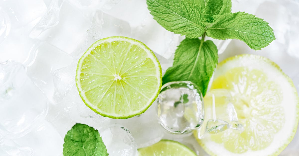 Mint vs Peppermint - Green Leaf on Clear Glass Mint vs Peppermint - Green Leaf on Clear Glass