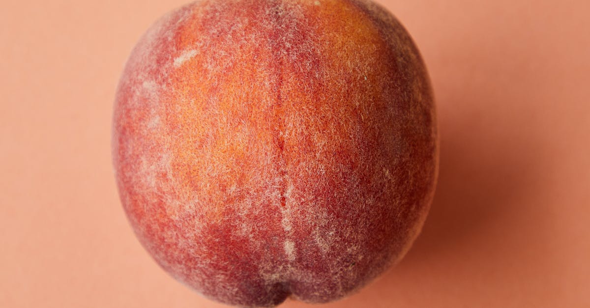 Missing ingredient from Peach Salsa can I recan - Fresh juicy pink peach on pink surface Missing ingredient from Peach Salsa can I recan - Fresh juicy pink peach on pink surface