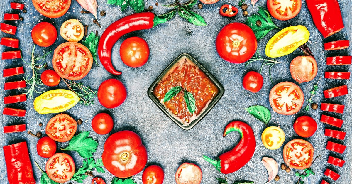 Missing ingredient from Peach Salsa can I recan - Top view of composition of colorful chili pepper and assorted tomato slices near fresh cilantro and parsley leaves with rosemary and thyme sprigs with bowl of savory sauce in center Missing ingredient from Peach Salsa can I recan - Top view of composition of colorful chili pepper and assorted tomato slices near fresh cilantro and parsley leaves with rosemary and thyme sprigs with bowl of savory sauce in center