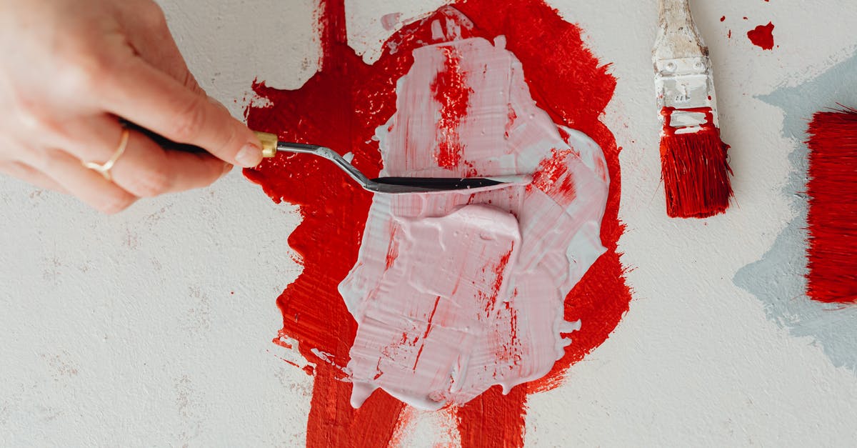 Mixing mozzarella without clumping - Person Holding Red Paint on White Wall Mixing mozzarella without clumping - Person Holding Red Paint on White Wall