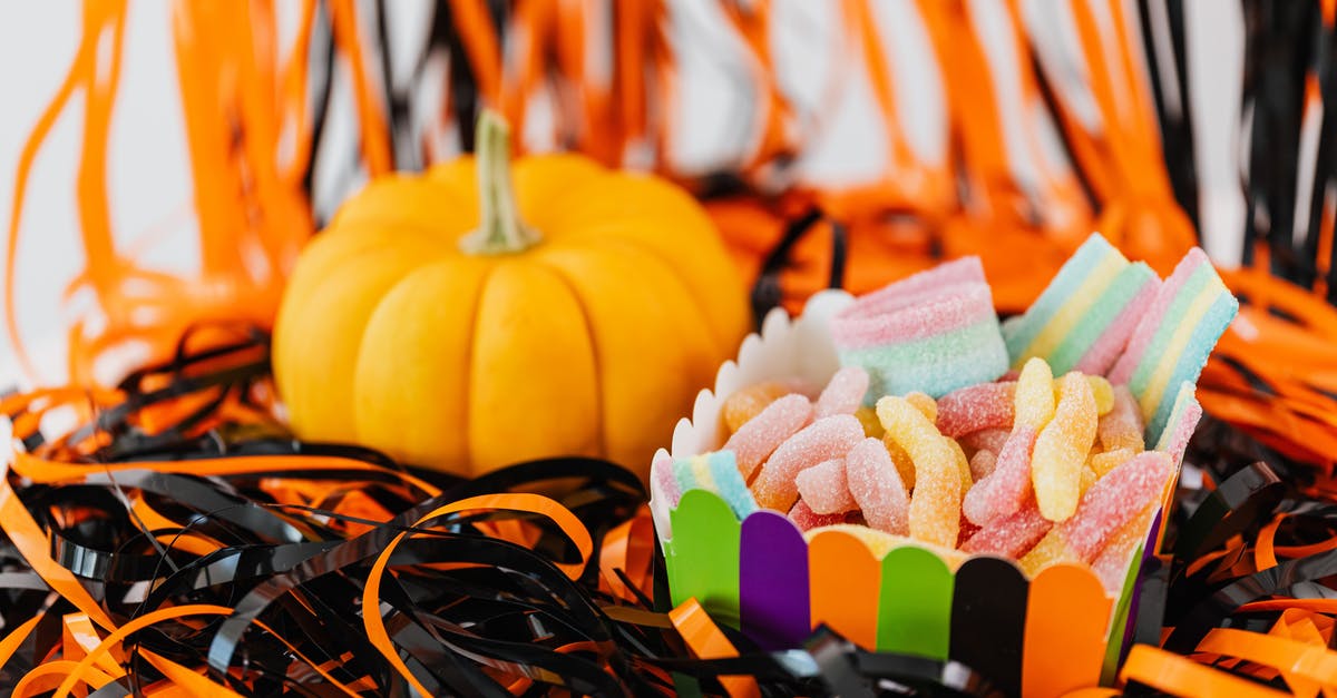 Mixing starches with sugar to make chewy candies - Assorted Chewy Candies in a Container Beside a Pumpkin
Mixing starches with sugar to make chewy candies - Assorted Chewy Candies in a Container Beside a Pumpkin