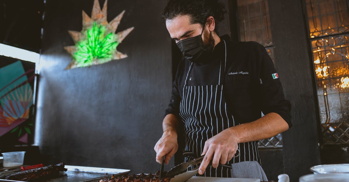 Modernist Cuisine-style BBQ brisket safety - A Man in Black Long Sleeves Wearing Face Mask while Slicing a Steak Modernist Cuisine-style BBQ brisket safety - A Man in Black Long Sleeves Wearing Face Mask while Slicing a Steak