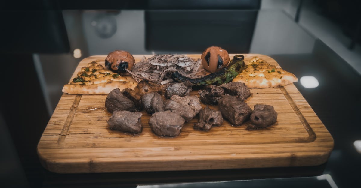 Mongolian BBQ Meat Cuts? - Delicious grilled food set on cutting board in kitchen Mongolian BBQ Meat Cuts? - Delicious grilled food set on cutting board in kitchen