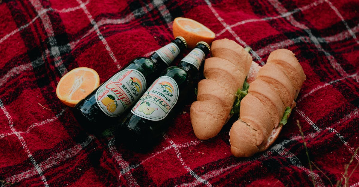 Moose Drool Beer Bread in a Bottle OVER 10 YRS. OLD - Beer Bottle and Baguettes Breads on a Picnic Blanket Moose Drool Beer Bread in a Bottle OVER 10 YRS. OLD - Beer Bottle and Baguettes Breads on a Picnic Blanket