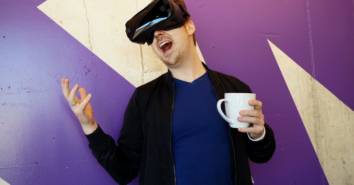 Mr. Coffee seems to know the future - Man Wearing Black Virtual Reality Headset while Holding White Mug Mr. Coffee seems to know the future - Man Wearing Black Virtual Reality Headset while Holding White Mug