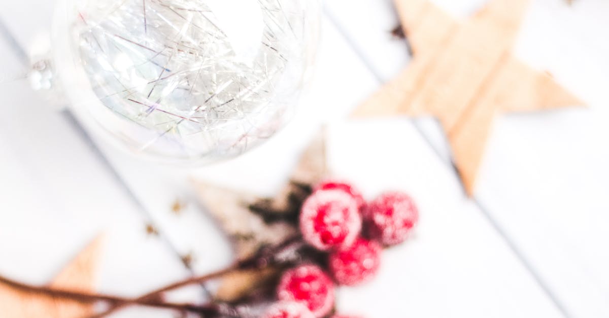 Muffin sticks to paper cases - Selective Focus Photo of Clear Bauble Seeing Red Mistletoe Muffin sticks to paper cases - Selective Focus Photo of Clear Bauble Seeing Red Mistletoe