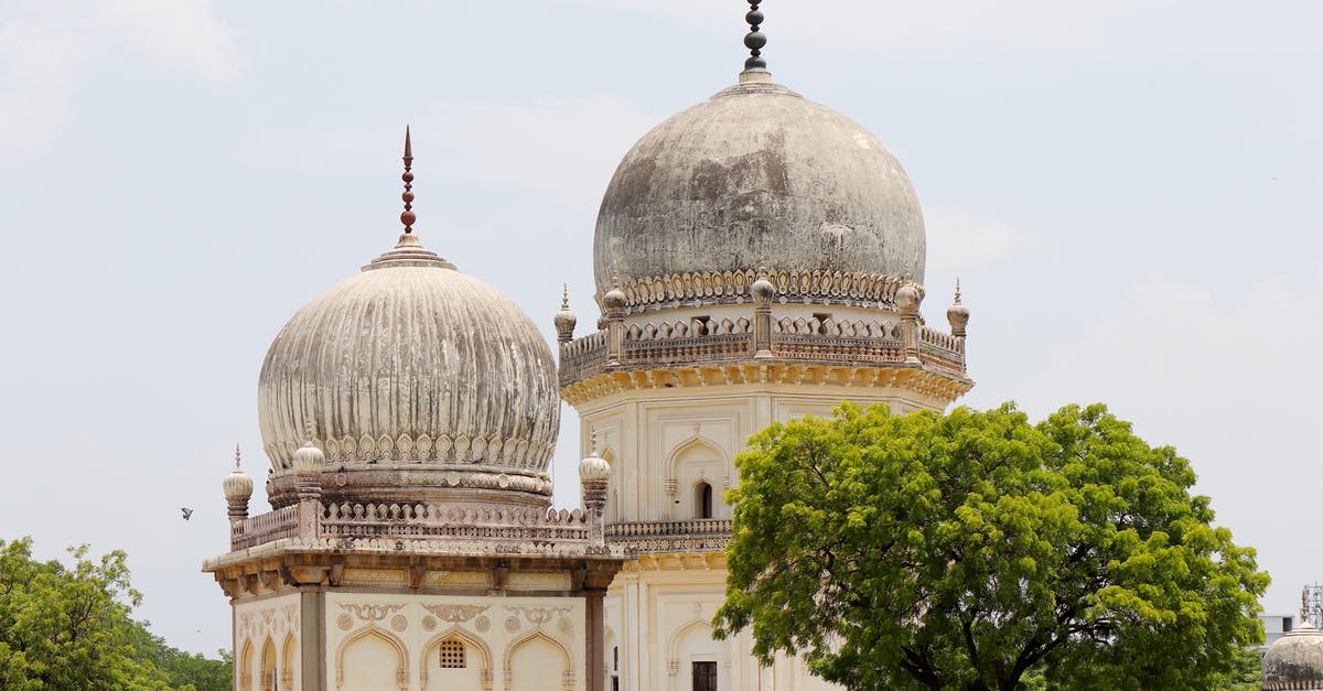 Murgh Shahi Korma - White and Brown Concrete Building Under the Blue Sky