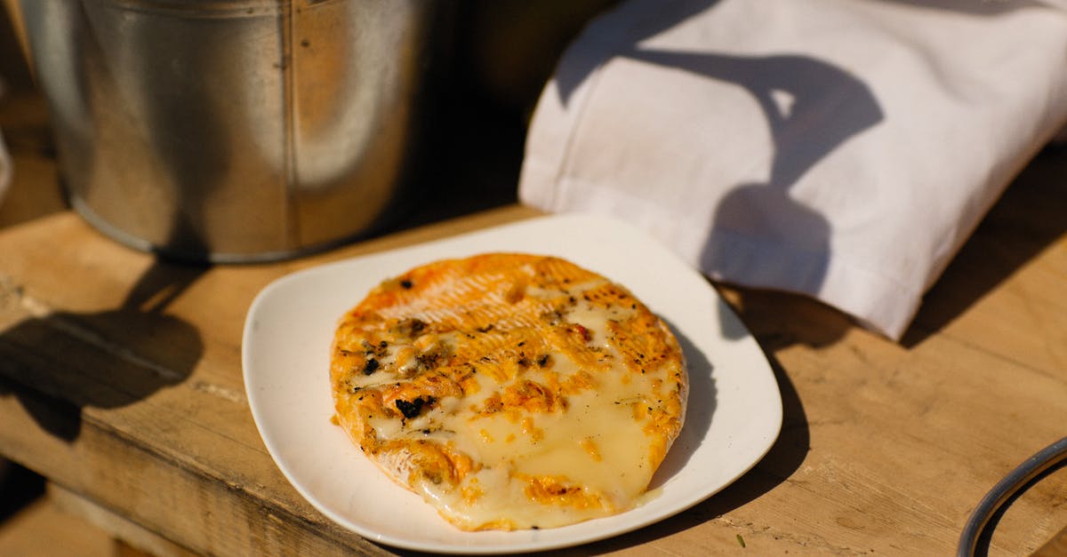 My Cheese Melted while in the Fridge? - Brown and White Round Pizza on White Ceramic Plate My Cheese Melted while in the Fridge? - Brown and White Round Pizza on White Ceramic Plate