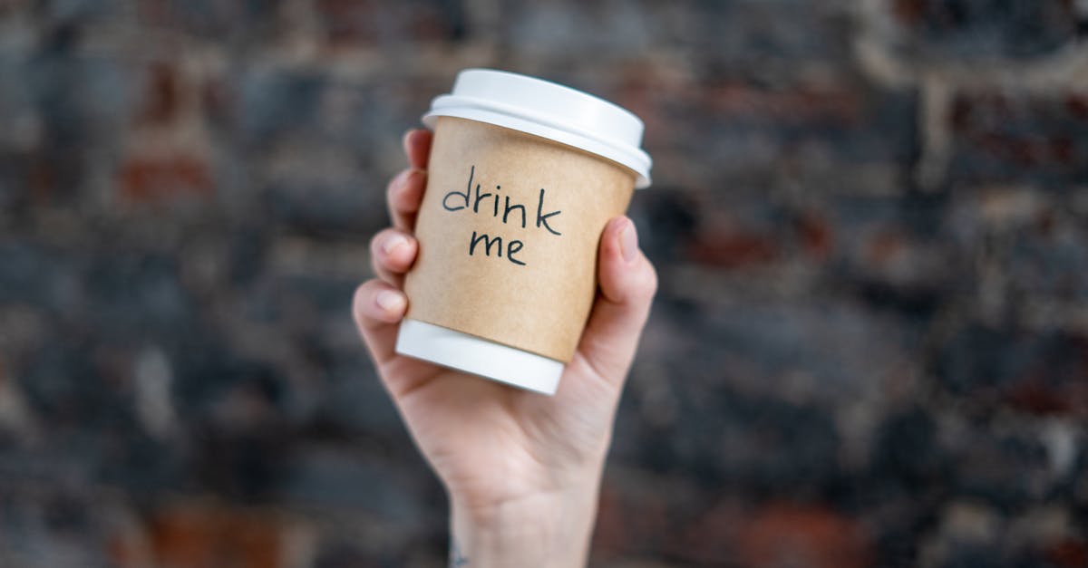 My drink electrocuted me - Person Holding White Plastic Cup My drink electrocuted me - Person Holding White Plastic Cup
