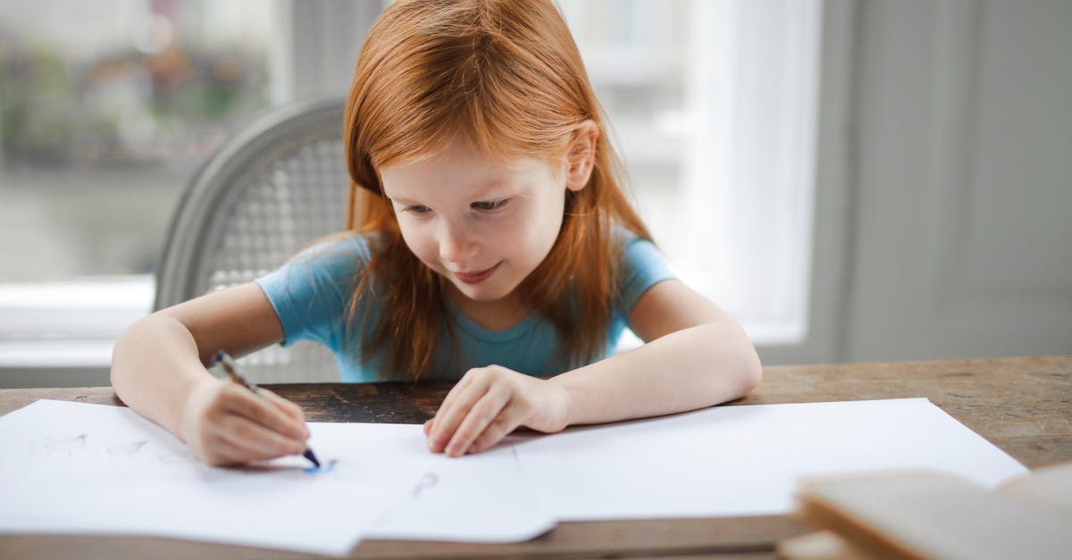 My ginger is blueish... is it safe? - Diligent small girl drawing on paper in light living room at home My ginger is blueish... is it safe? - Diligent small girl drawing on paper in light living room at home