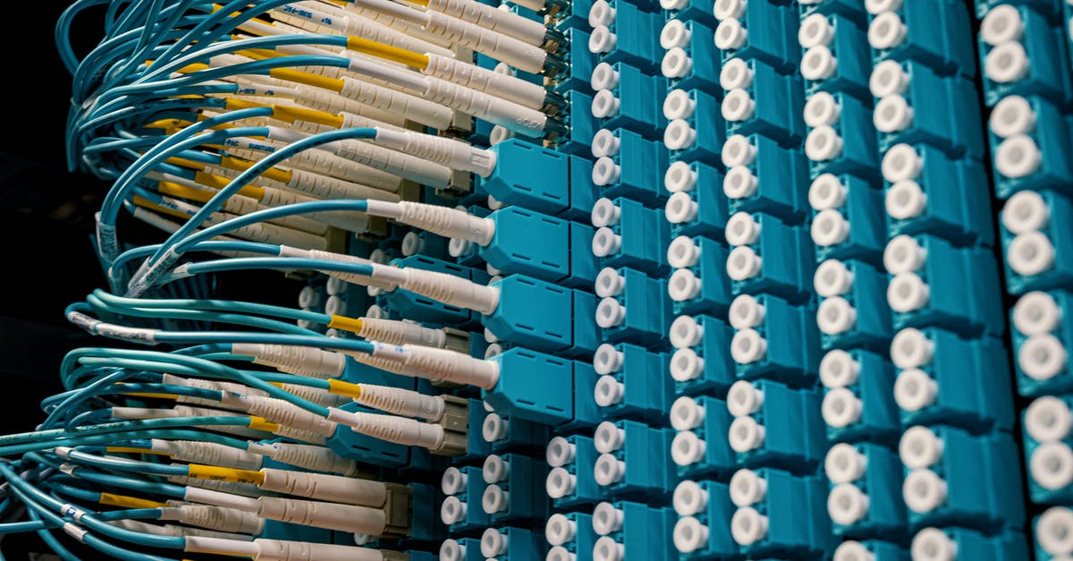 My white device has turned yellow - From below of fiber optic equipment with similar colorful rubber cables and round sockets My white device has turned yellow - From below of fiber optic equipment with similar colorful rubber cables and round sockets