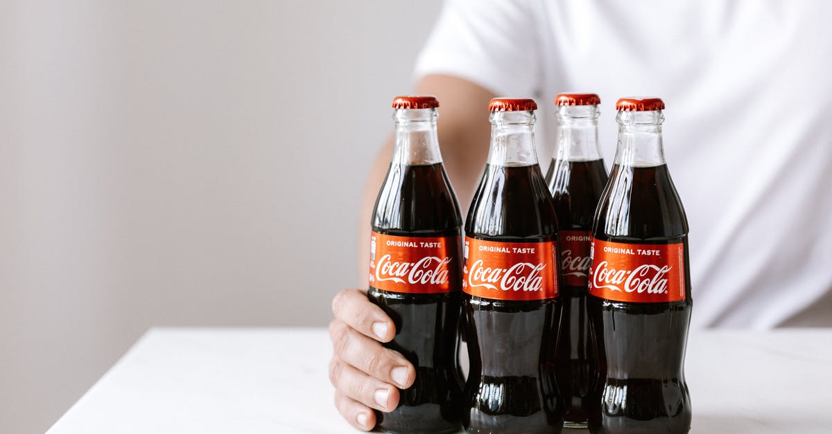 My yeast doesn't bubble but kinda works? - Crop anonymous young male in white t shirt demonstrating glass bottles of coke while sitting at table My yeast doesn't bubble but kinda works? - Crop anonymous young male in white t shirt demonstrating glass bottles of coke while sitting at table