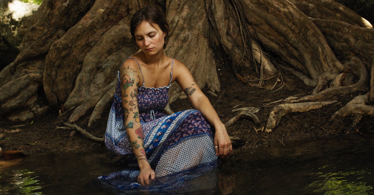 My yeast looks lke brown water - Tattooed Woman in Sleeveless Dress sitting in Water at Foot of Big Tree My yeast looks lke brown water - Tattooed Woman in Sleeveless Dress sitting in Water at Foot of Big Tree