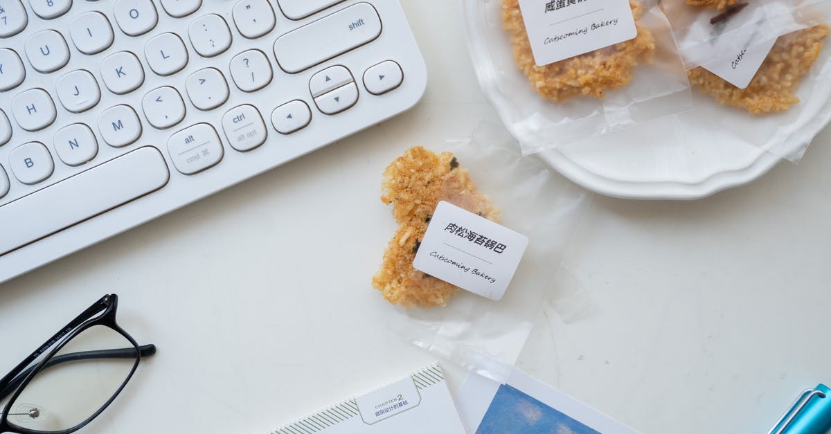 Name of a Chinese sweet - Set of keyboard and snack on white table Name of a Chinese sweet - Set of keyboard and snack on white table