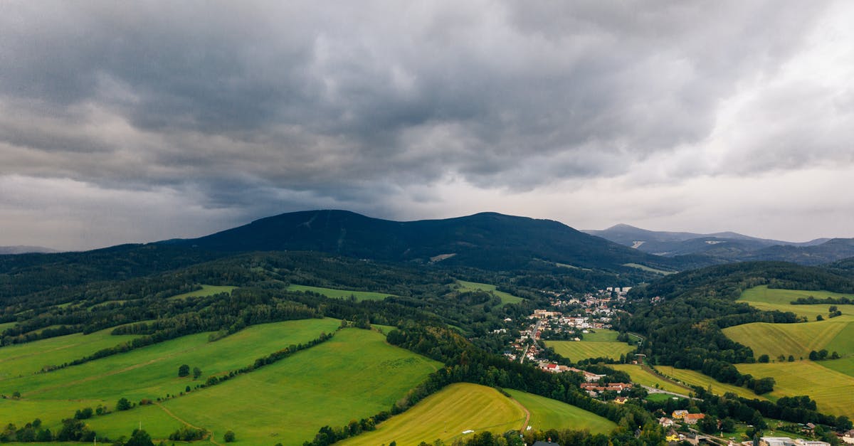 Name the vegetable from Nilgiri hills - Aerial Photo of A Town And Its Surrounding Landscape Under Cloudy Sky Name the vegetable from Nilgiri hills - Aerial Photo of A Town And Its Surrounding Landscape Under Cloudy Sky