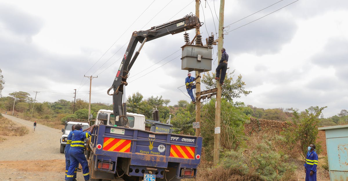Need to maintain gelato at 10-18 °F without electricity - Men Working and Fixing an Electricity Pole Need to maintain gelato at 10-18 °F without electricity - Men Working and Fixing an Electricity Pole
