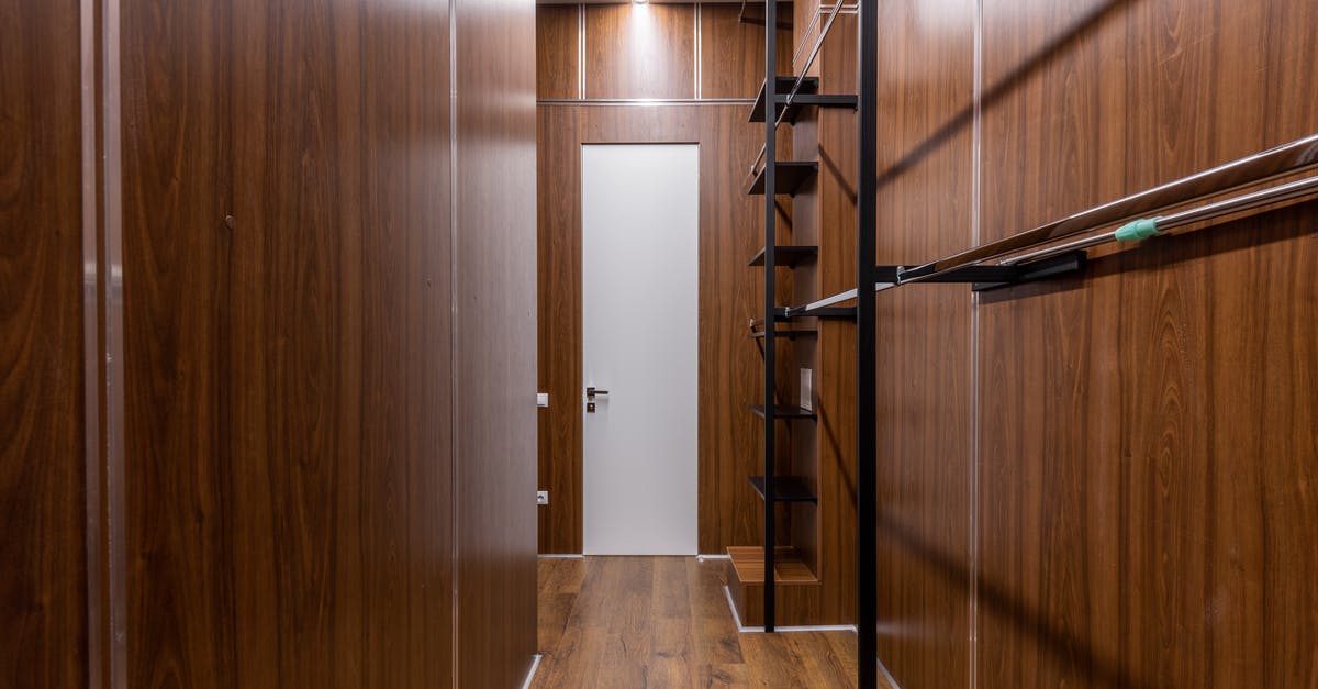 New lodge cast iron pan brown colour - Empty black shelves and racks placed near brown walls in corridor with minimalist style with white door and glowing illumination New lodge cast iron pan brown colour - Empty black shelves and racks placed near brown walls in corridor with minimalist style with white door and glowing illumination