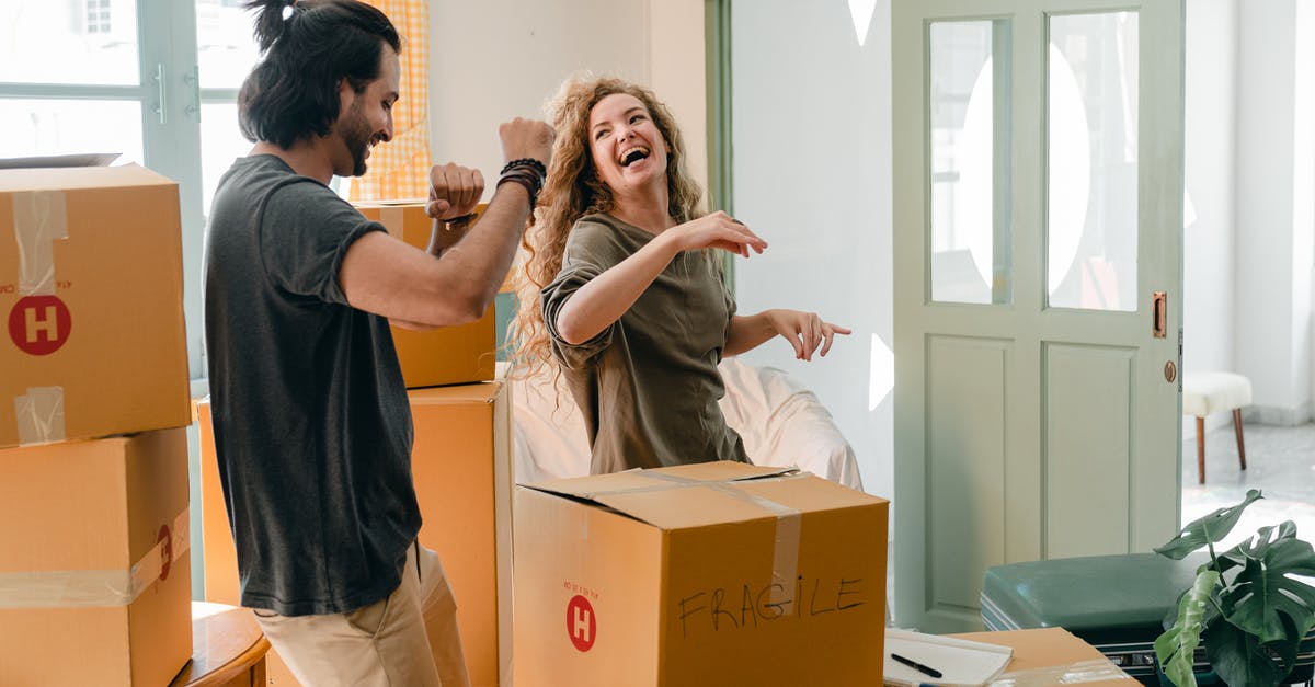 New to sous vide and not having any luck - Cheerful laughing couple in casual clothes having fun and dancing together while unpacking carton boxes after moving into new contemporary apartment New to sous vide and not having any luck - Cheerful laughing couple in casual clothes having fun and dancing together while unpacking carton boxes after moving into new contemporary apartment