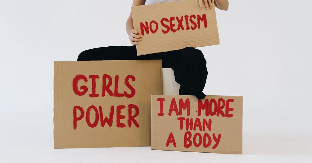 Nixtamalization: Am I doing it right? - A Woman Showing Three Placards